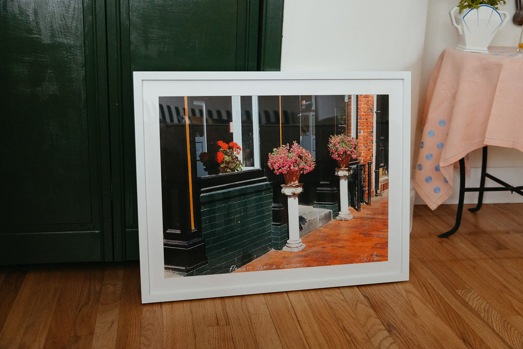 Photograph of Flowers Near a Doorway